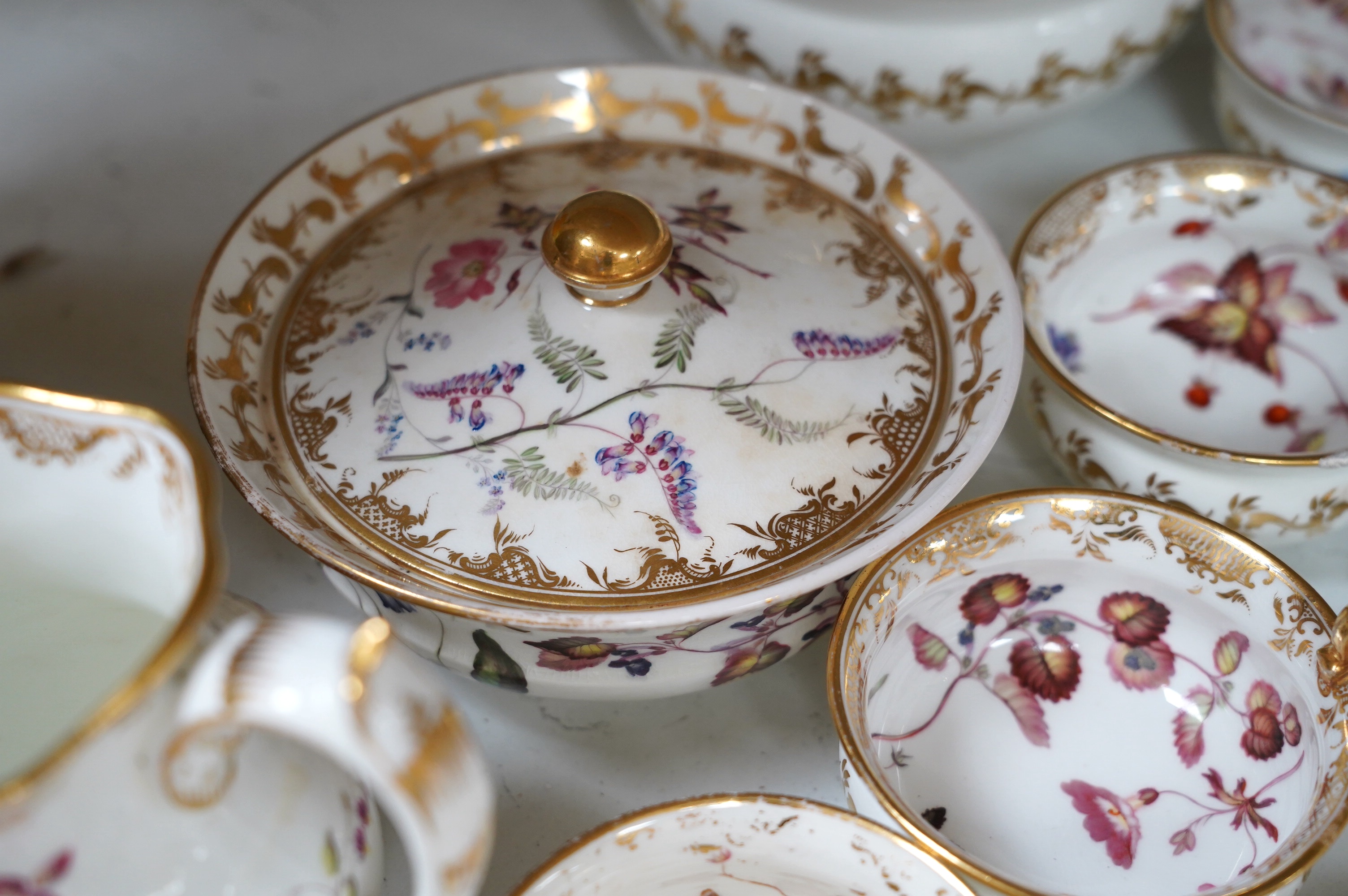 A floral part tea and coffee set, probably Swansea, c.1815-20, largest 23.5cm diameter. Condition - mostly fair